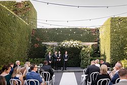 Traditional Luxe Wedding Quat Quatta ceremony set up flower arbour groom + groomsmen waiting on brides arrival