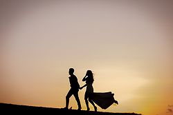 Traditional Luxe Wedding Quat Quatta bride + Groom walking sunset silhouette