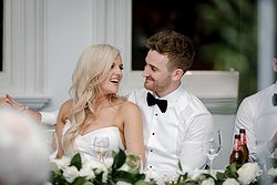 Traditional Luxe Wedding Quat Quatta bride + Groom seated laughing speeches